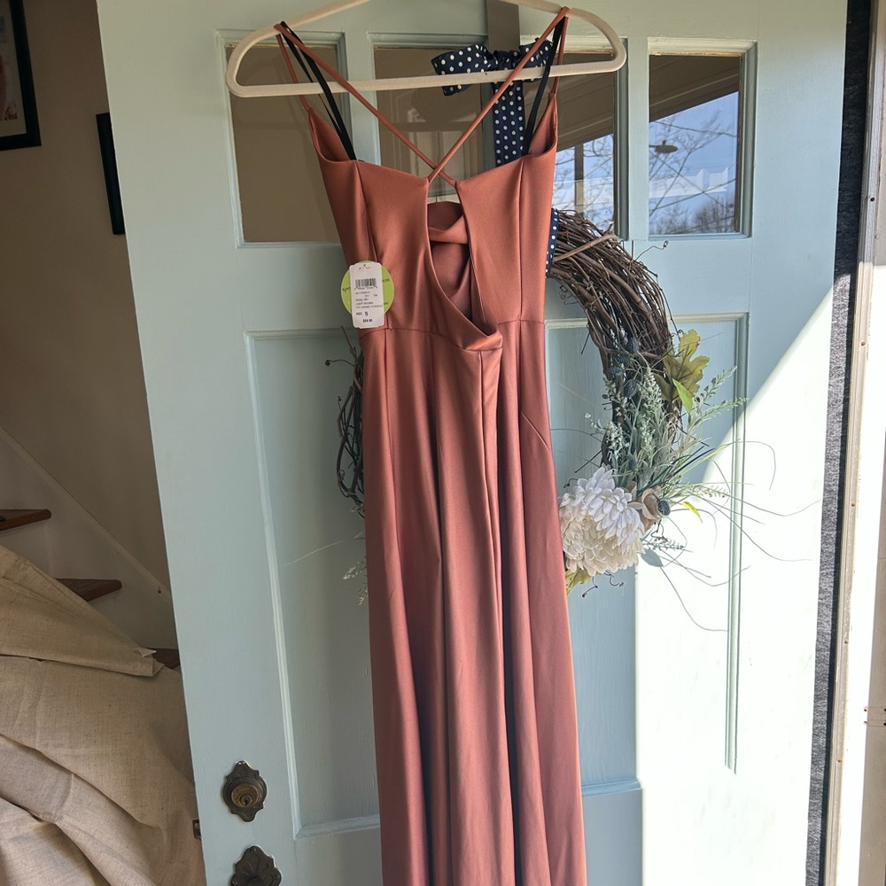Formal dress with slit on side . Terracotta color. Brand new never worn .